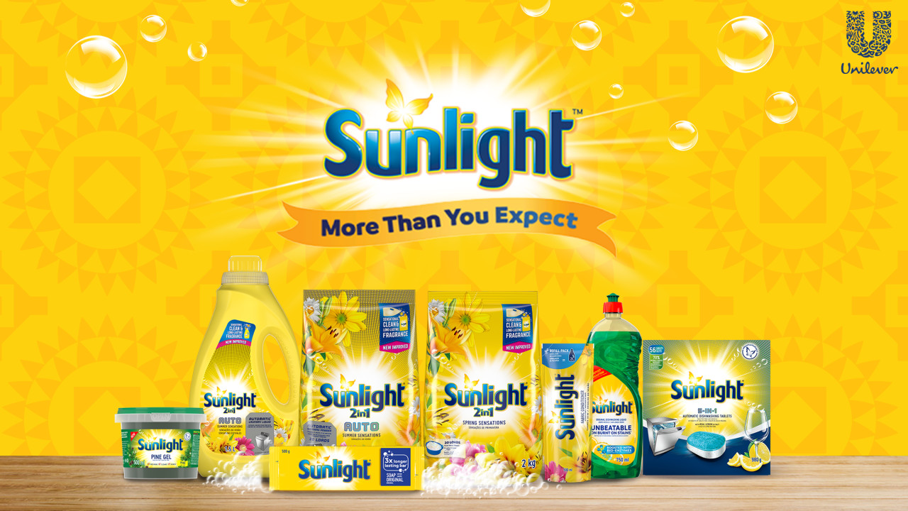 Yellow background with Sunlight logo and text underneath "more than you expect" with pack line up below. 